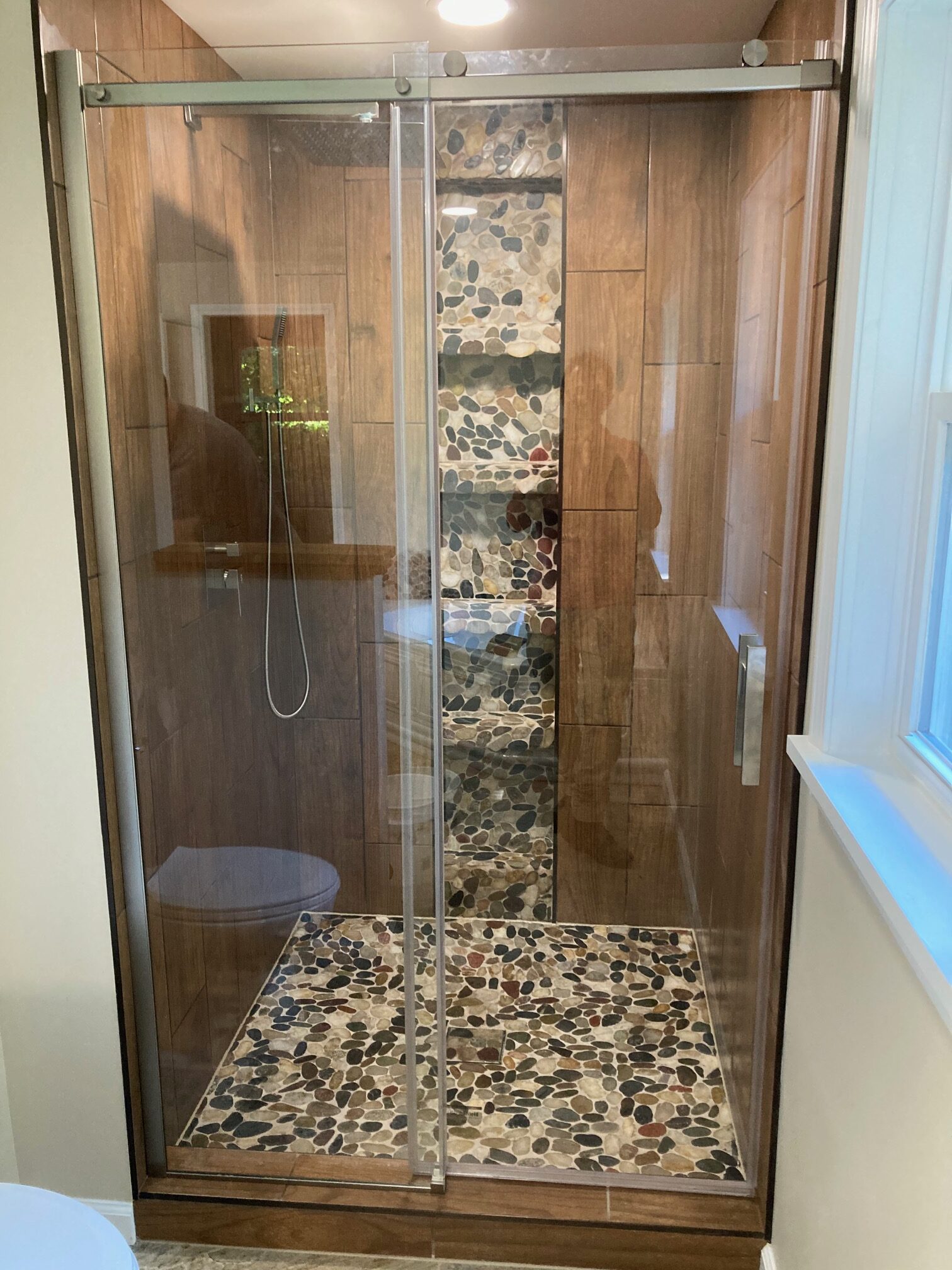 Custom Tile Design in Glass Enclosures at FLX Flooring